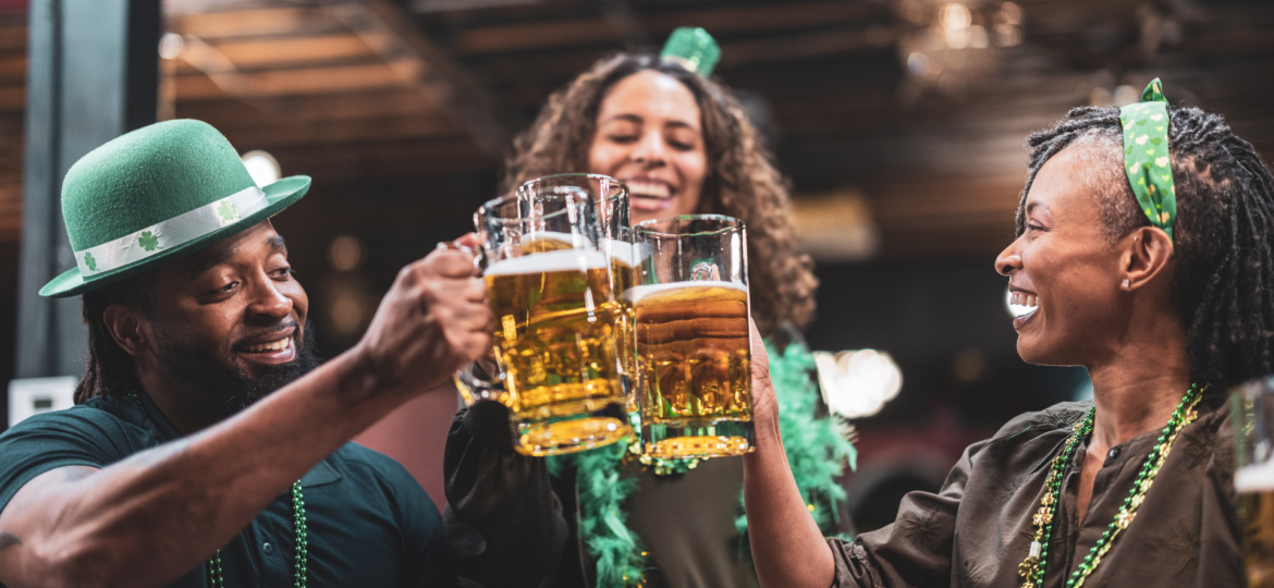 A group of friends dressed in St. Patrick’s Day gear, partying with a Detroit party bus while celebrating St. Patrick's day in metro Detroit.