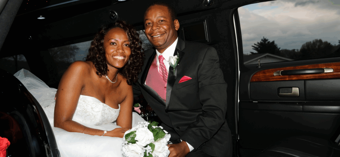 A bride and groom in a limousine rental from Dream Limousine